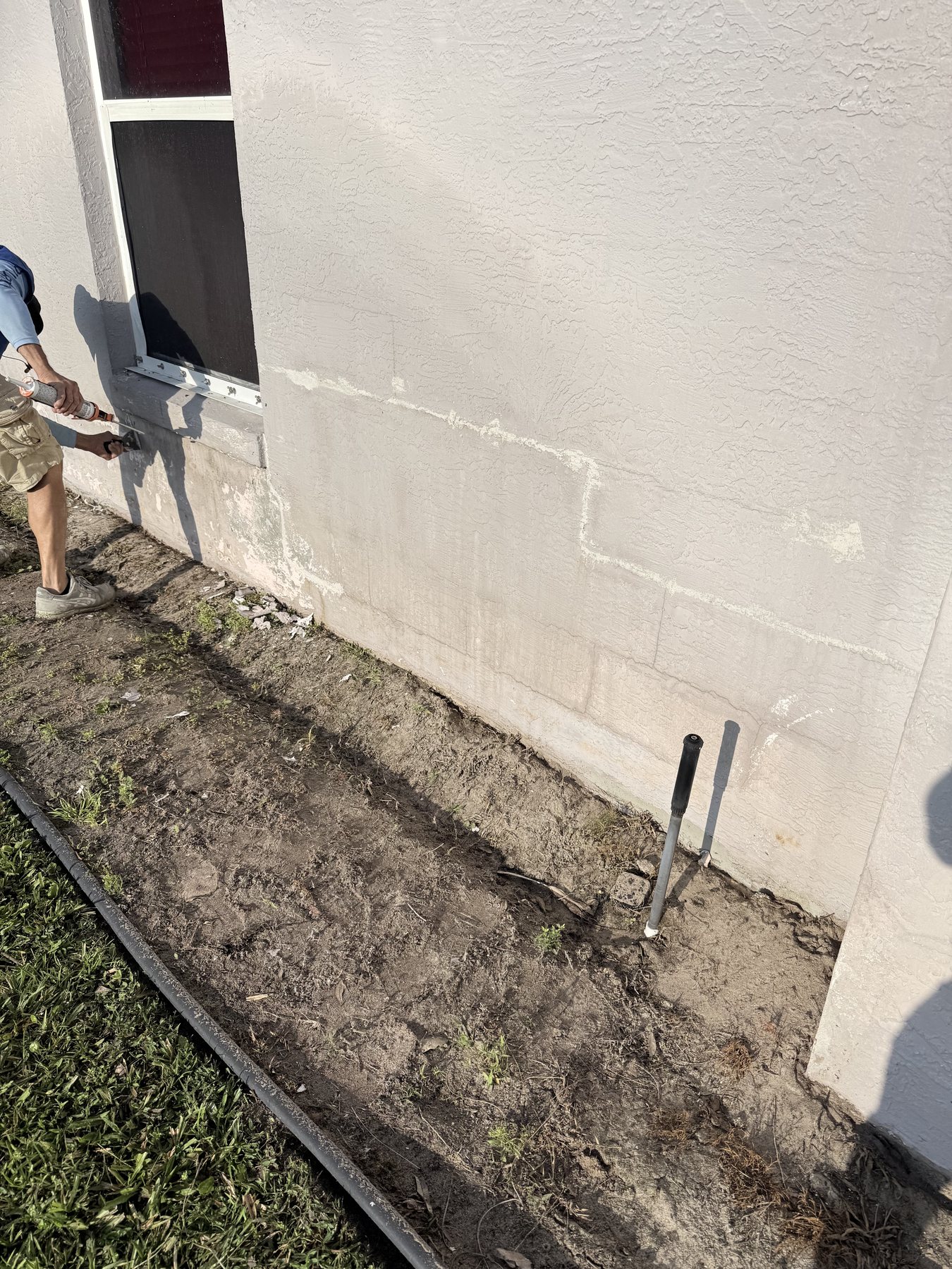 Exterior stucco repair area prepared for Drej360 coating work