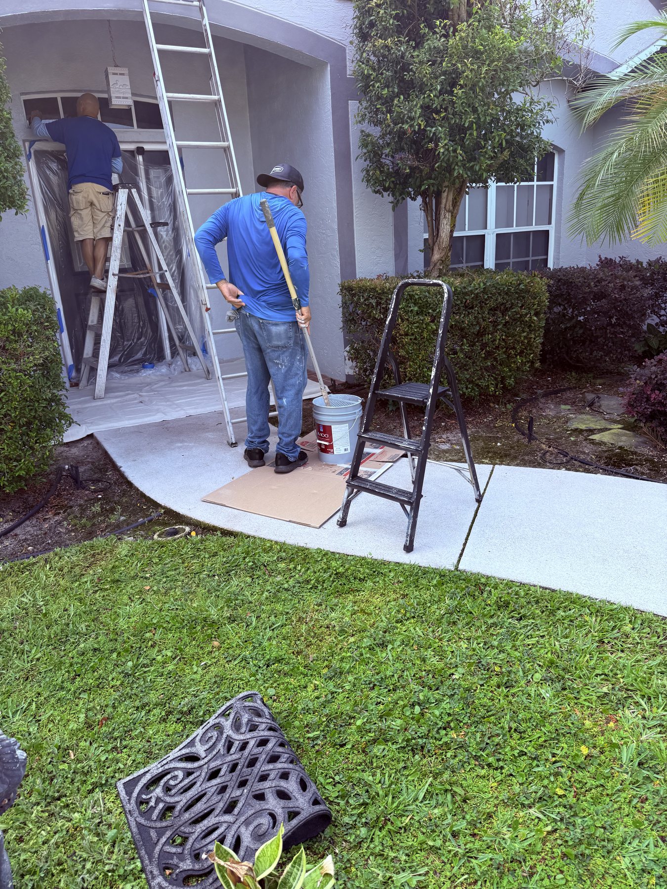 Drej360 crew working on an exterior residential painting project