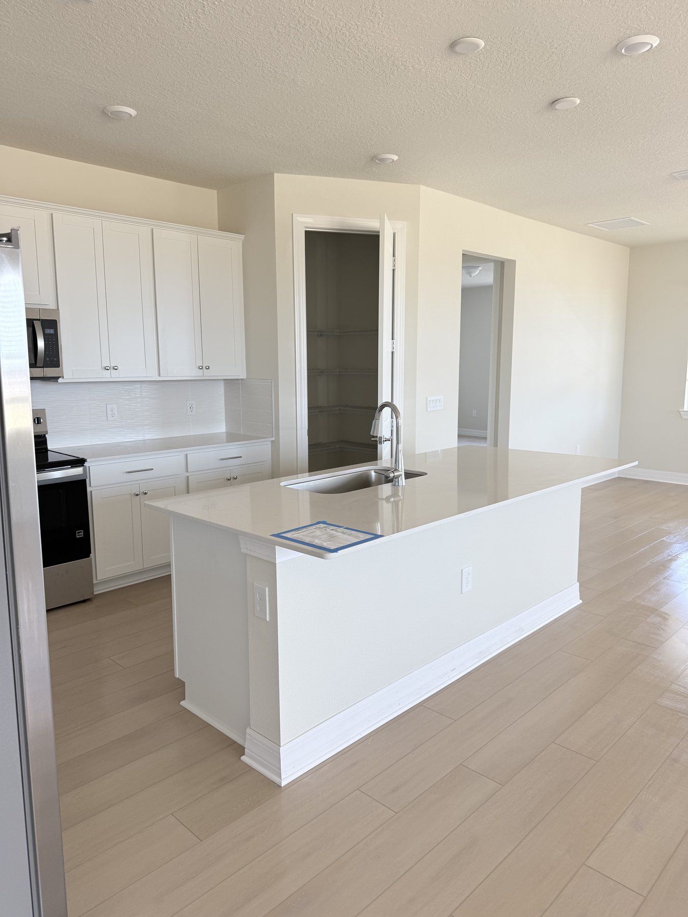 Freshly painted bright interior kitchen and living area