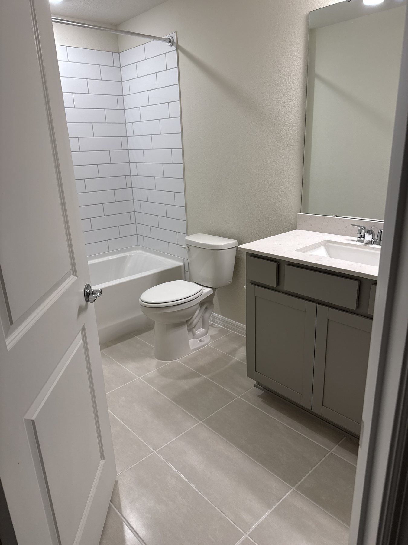 Freshly finished bathroom interior with vanity and shower tile